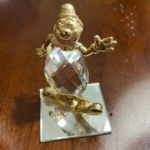 Vintage Crystal Clown figurine on mirror plate.